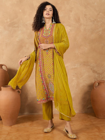 varanga Women A Mustard Ethnic-Printed Kurta Set With Bead And Stone Detailing, Paired With Solid Trousers And A Dupatta Perfect For Festive Celebrations With A Touch Of Contemporary Charm.